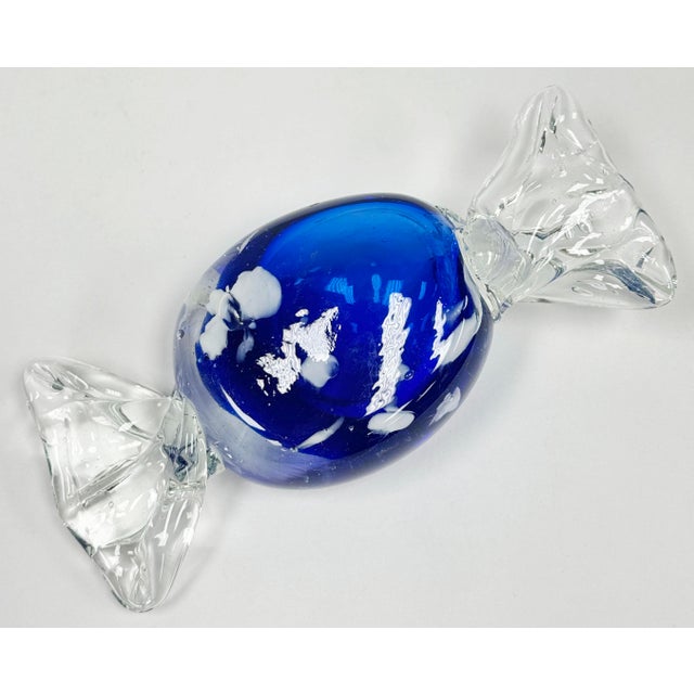Oversized vintage Murano style blown glass wrap candy. Bright blue with irregular white dots measuring 5.5" wide. Age...