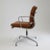 A classic Eames Aluminum Group Side Chair with Arms for Herman Miller, featuring the iconic Soft Pad design and a clean,...