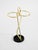 Elegant Mid-Century Modern umbrella stand featuring brass and a black cast-iron base. Minimalist, high-quality design....