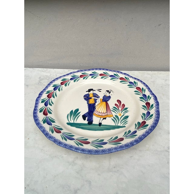 French Faience Plate Quimper circa 1960. Couple of bretons dancing.