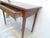 This cherry table or small desk has a singe dove-tailed drawer, the back is unfinished.