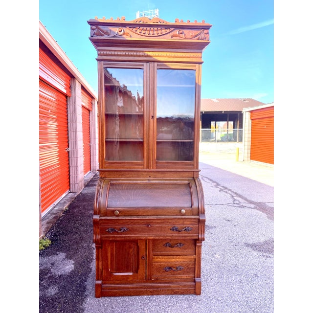 Antique Victorian Eastlake carved walnut cylinder roll-top secretary desk. This 1800’s piece is filled with antique...
