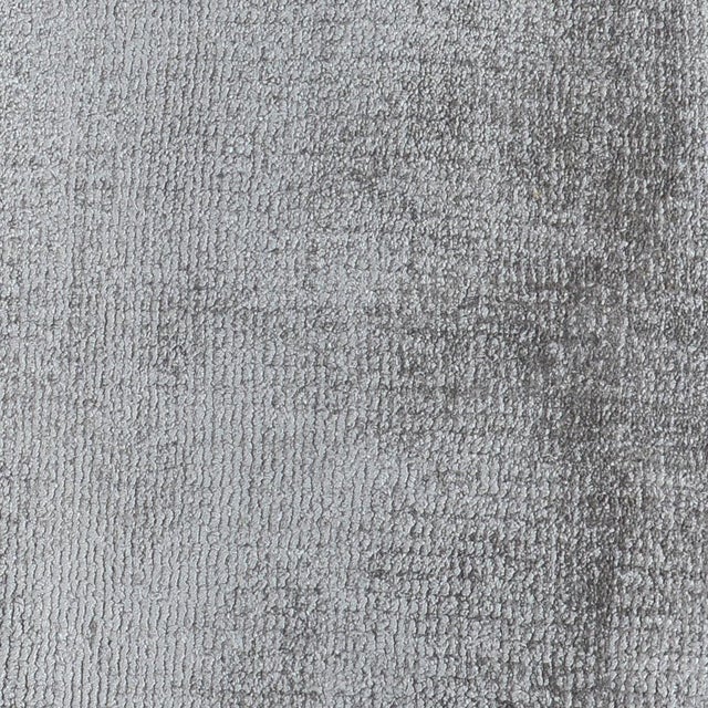 Soft luxurious dove gray silk-like viscose-cotton rug. Lightly distressed finish for texture and dimension. Available in...