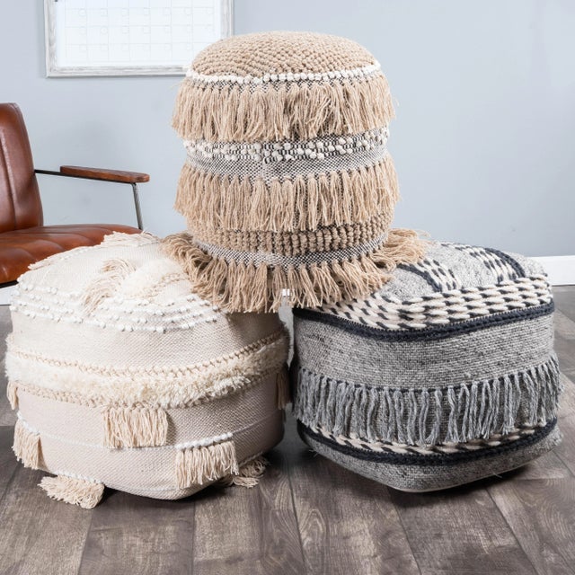 Create a comfy casual space with the addition of this tasseled pouf. Its inviting Bohemian vibe lends casual elegance to...