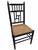 Elegant late 20th century faux bamboo accent chair featuring a satin black finish and beautifully preserved natural woven...