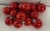 Nice set of 14 red glass tree ornament balls.
