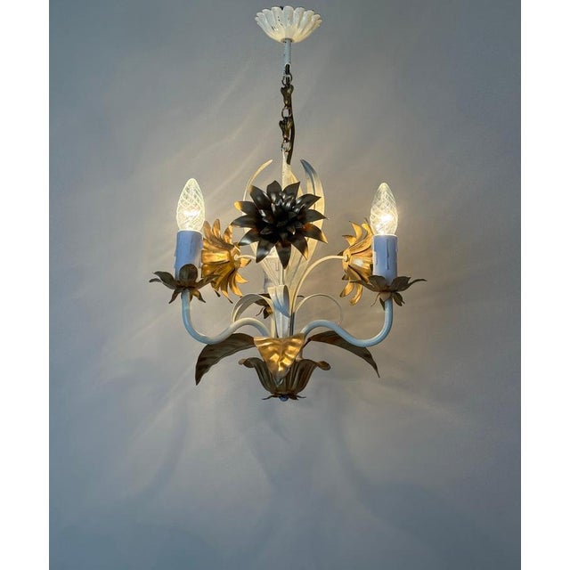 This rare and elegant hollywood regency chandelier perfectly embodies mid-century glamour and timeless sophistication. The...