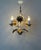 This rare and elegant hollywood regency chandelier perfectly embodies mid-century glamour and timeless sophistication. The...