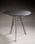 Pascal MOURGUE (1943-2014): Table with a circular top in speckled anthracite grey metal and a pair of armchairs in black...