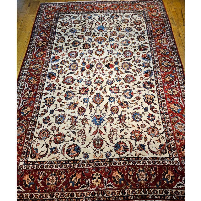 This beautiful vintage Persian Isfahan room-size rug, from the second quarter of the 20th century, features a classic...