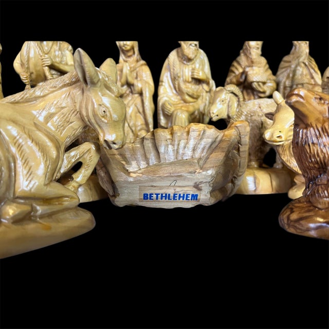 This exceptional mid-20th century Bethlehem olive wood Nativity set represents the finest tradition of Holy Land...