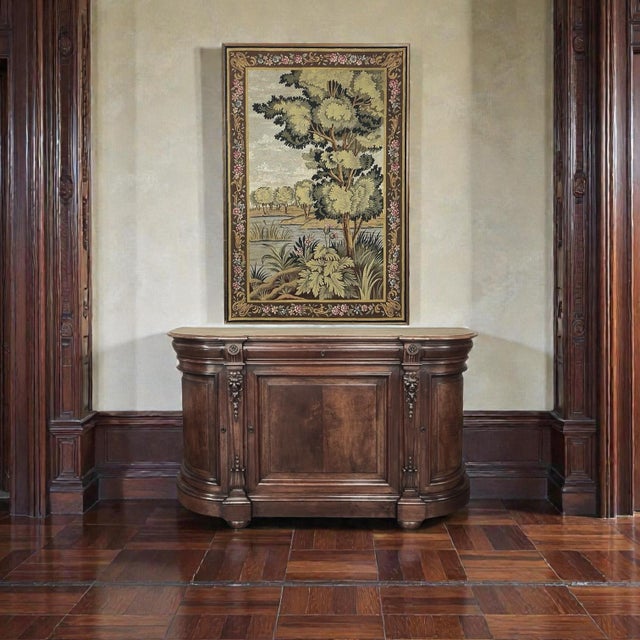 Rich in detail and executed with remarkable skill, this 19th century walnut buffet reflects the stately elegance of the...