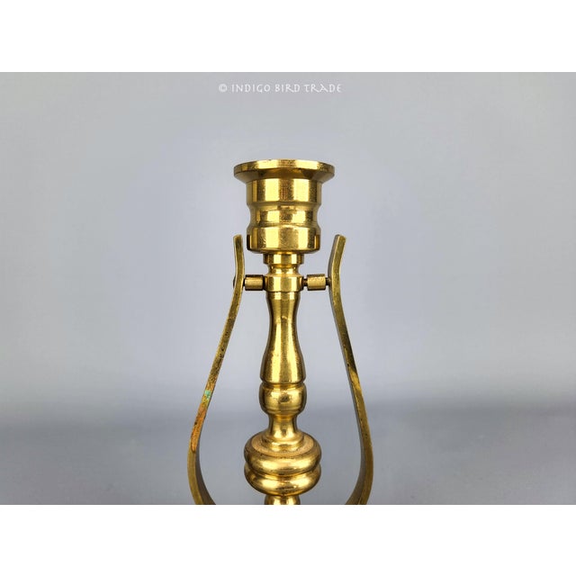 This beautiful candle holder is made from solid brass. It features natural patina from the age and ready to bring a...