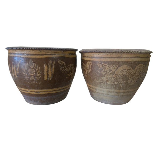 Pair of Chinese Glazed Dragon Terracotta Planters. Each measures roughly 19" diameter, and 15" high.