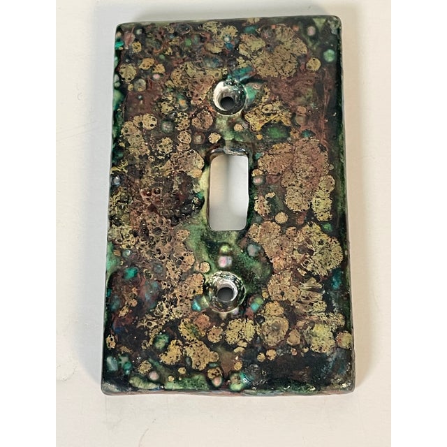 Artisan voyage signed Ruby Nansen and dated ceramic switch plate unique.