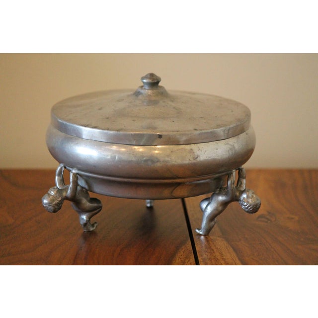 A rare presentation of a divided depression glass dish from the 1930's! An aluminum outer dish with 3 cherubs acting as...