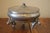 A rare presentation of a divided depression glass dish from the 1930's! An aluminum outer dish with 3 cherubs acting as...