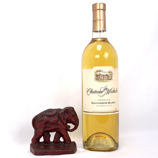 A small but heavy cast iron elephant bookend with a deep red finish. The size is smaller than many elephant bookends, but...