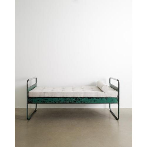 A rare green lacquered french mid century "no 17 / fabert" daybed in aluminium, metal with a newly upholstered linen...