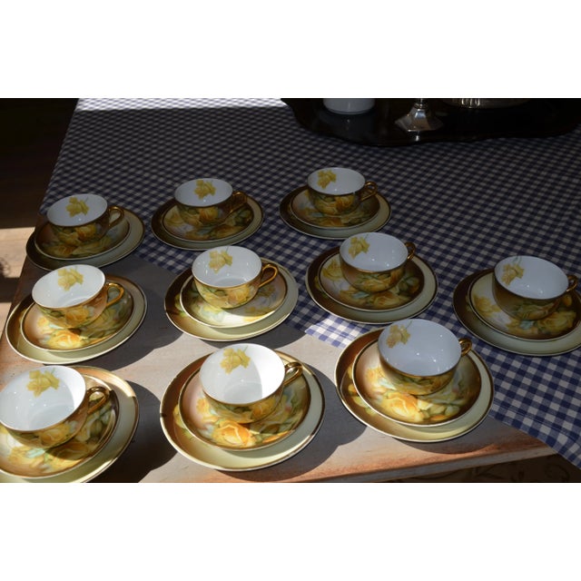 - Porcelain tea service comprising 10 sets of cups, saucers and plates - Decorated with a rose/floral design by the...