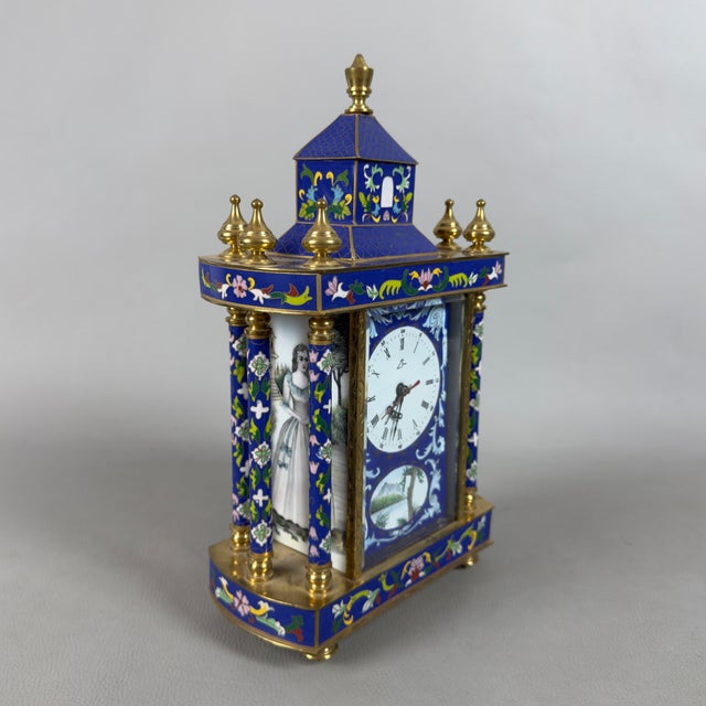 A refined mechanical table clock with an oriental architecture, embellished with polychrome cloisonné enamels and...