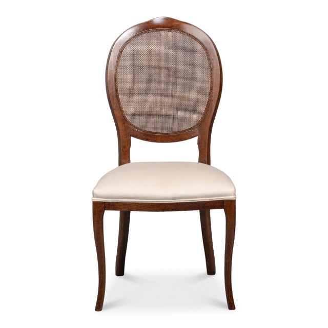 Woven oval backs sit within walnut frames above softly bowed front rails, retaining the curved outline of Louis XV...