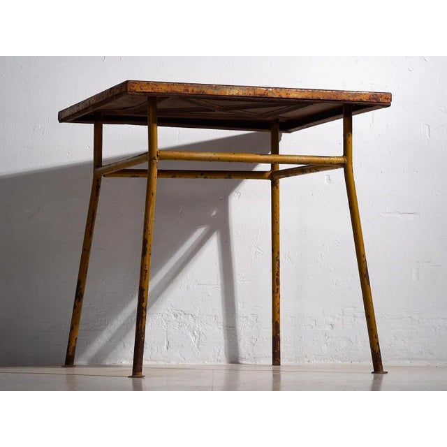 Ochre colored antique outdoor table (c.1920) Approximate age: 150 years Material: Iron Origin: France Our antique outdoor...