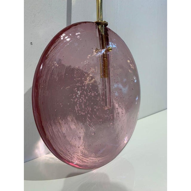 Beautiful decorative Murano glass disc form pendant lights in a great shade of purple. Nice brass pendant as well. Very...