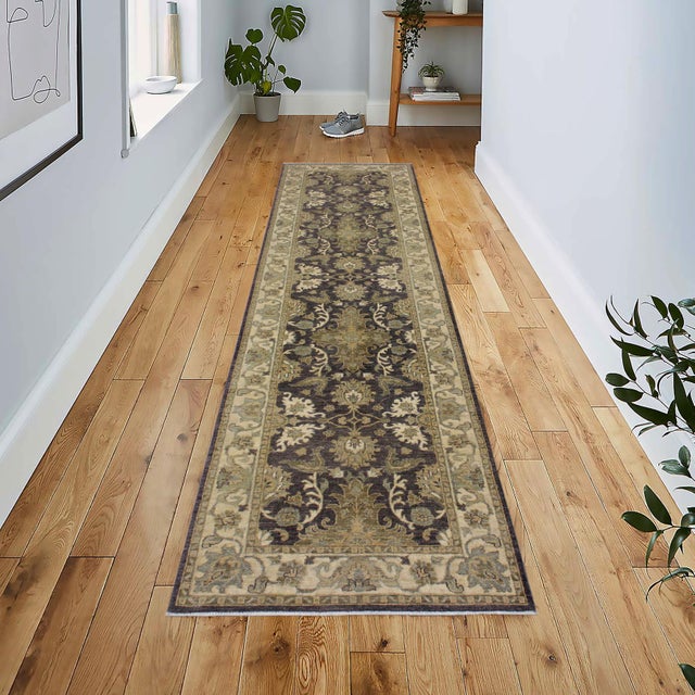 Enhance the ambiance of your home with this magnificent Persian-influenced Turkish hand-knotted rug made by skilled...