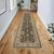 Enhance the ambiance of your home with this magnificent Persian-influenced Turkish hand-knotted rug made by skilled...