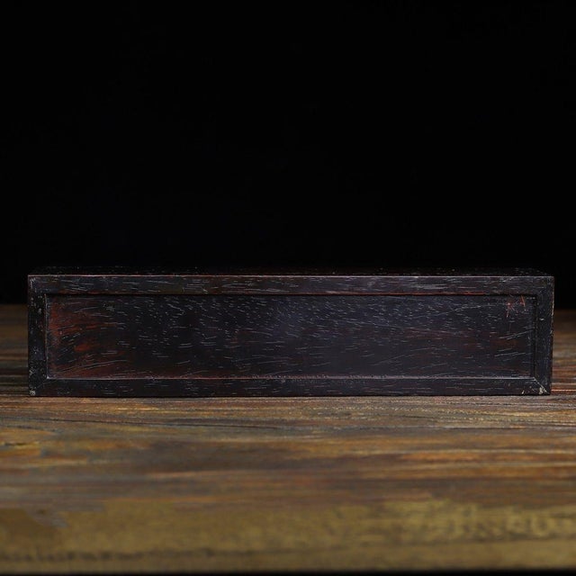 Beautiful vintage Chinese slide storage box crafted from solid red rosewood. The top surface is decorated with intricate...