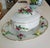 A substantial oval covered tureen and matching serving platter, made by the raynaud factory in limoges, france, circa...