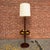 Vintage mid-century modern walnut floor lamp with a built-in table and original ceramic accessories. The rounded...