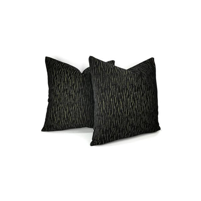 This fabric is from designer brand S. Harris and it is call MAGIC in the color Jet Black. The fabric is black and gold...