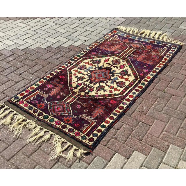 This beautiful, traditional vintage, hand knotted Turkish small rug is approximately 60 years old. It is handmade of very...