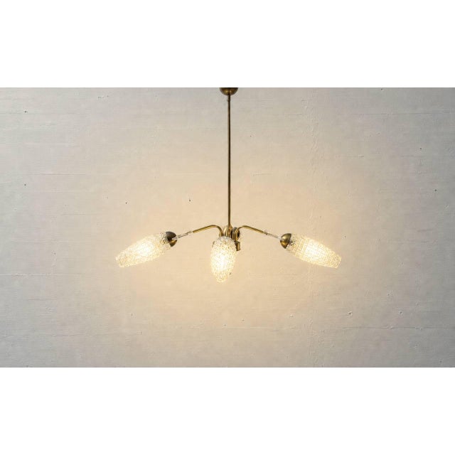 Elegant mid-century ceiling light with a finely balanced, Sputnik-inspired design from the 1950s and 60s. The light...