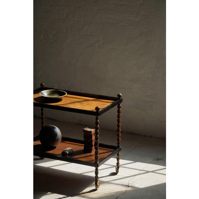 This stunning serving table in oak with twisted legs is a beautiful example of early 20th-century Danish craftsmanship....