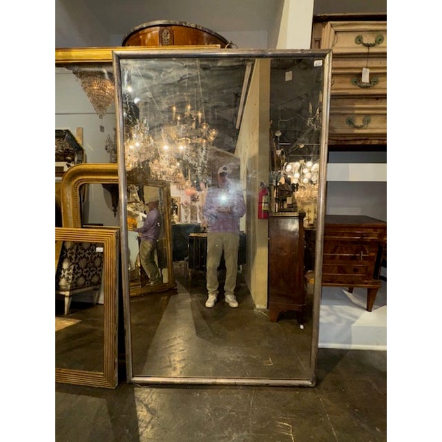 The 19th Century French Silver Leaf Louis Philippe Transitional Mirror features a stunning antique design. The frame is...