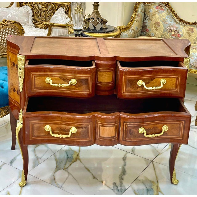 Bring refined European elegance to your interior with this beautifully crafted French-style wooden commode, featuring a...