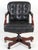 A traditional tufted leather executive office chair. The chair is upholstered in high quality leather and has leather...