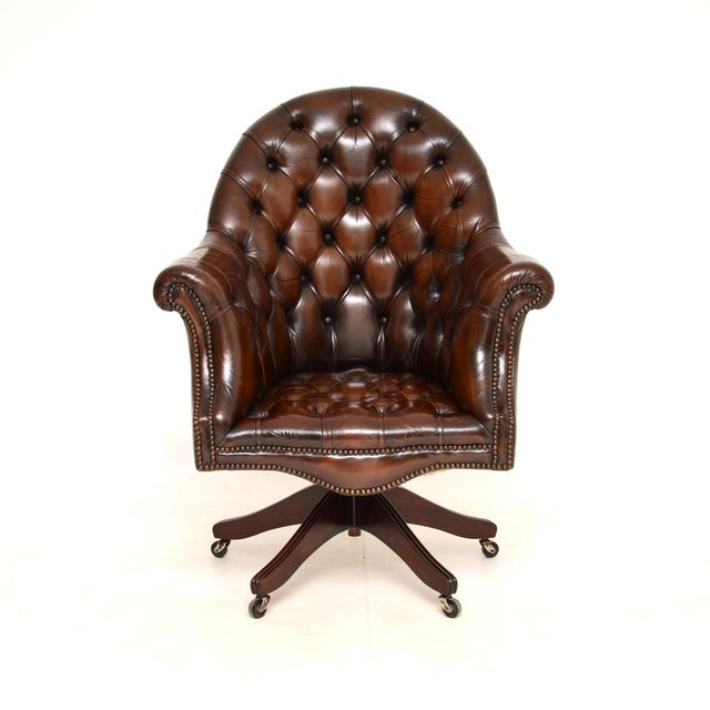 A smart and extremely well made antique Victorian style leather swivel Directors desk chair. This was made in England and...