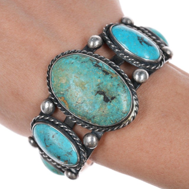 6.25" Sturdy Vintage Native American sterling turquoise graduated row cuff bracelet. Solid sterling silver, unmarked as...