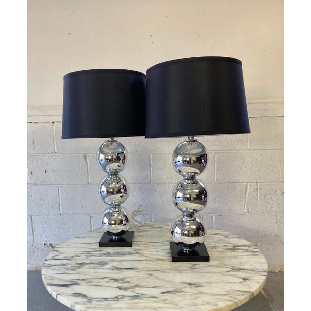 Pair of Chrome Ball Table Lamps in the Style of Kovacs with black shades Very modern and luxe chrome lamps done in the...