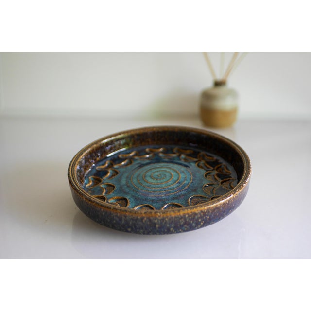 A small stoneware vintage Bornholm pottery plate or Vide-poche from Denmark. Made by the talented Michael Andersen, this...