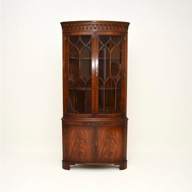 A very impressive antique Georgian style bow front corner cabinet. This was made in England, we would date it to around...