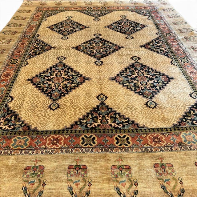 A beautifully composed vintage rug, approximately 40 years old, inspired by classic Serapi designs and featuring a...