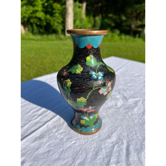 Single small round Chinese brass polychrome cloisonné vase with floral decoration.