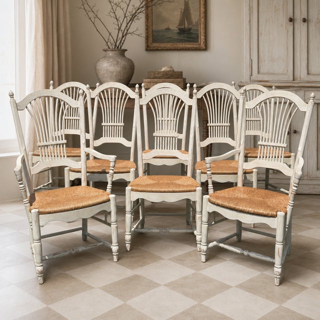 A handsome set of eight Habersham Plantation dining chairs consisting of two armchairs and six side chairs. The chairs...