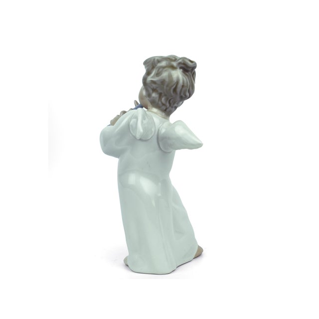 This elegant Lladro "Angel with Flute" (No. 4540) is a standout collector's piece, featuring a hand-signed "J. Lladro"...