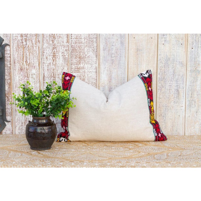 This linen pillow is flanked by rare antique tribal borders, it is bordered by hand-woven, ply-split camel girth lace and...